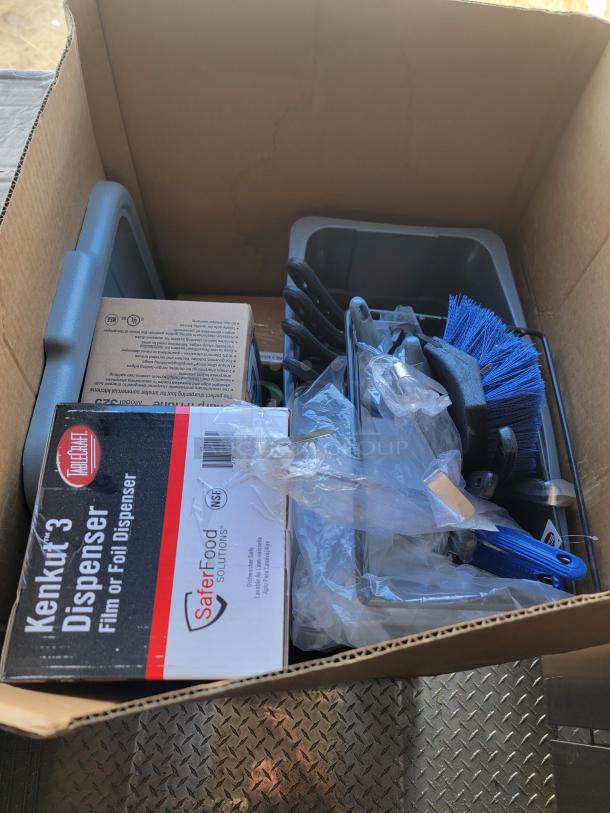 Box containing new TrueCraft Kenkut 3 film dispenser, blue brush, and various cleaning tools with visible packaging labels.