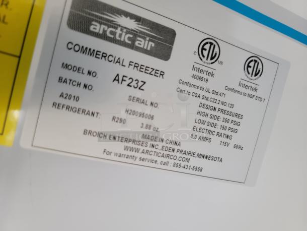 Arctic Air Commercial Freezer model AF23Z label displays design pressures, refrigerant type R290, and electrical specifications.