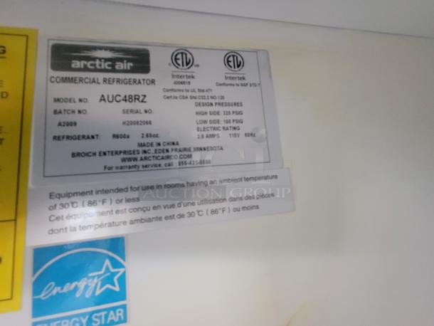 Arctic Air AUC48RZ commercial refrigerator label, model info, ETL certification, refrigerant R290, Energy Star logo visible.