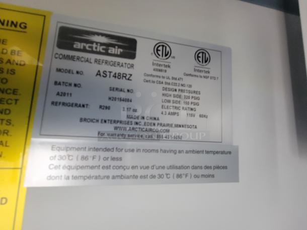 Arctic Air commercial refrigerator label, Model AST48RZ, shows serial number, electrical rating, and pressure specifications.