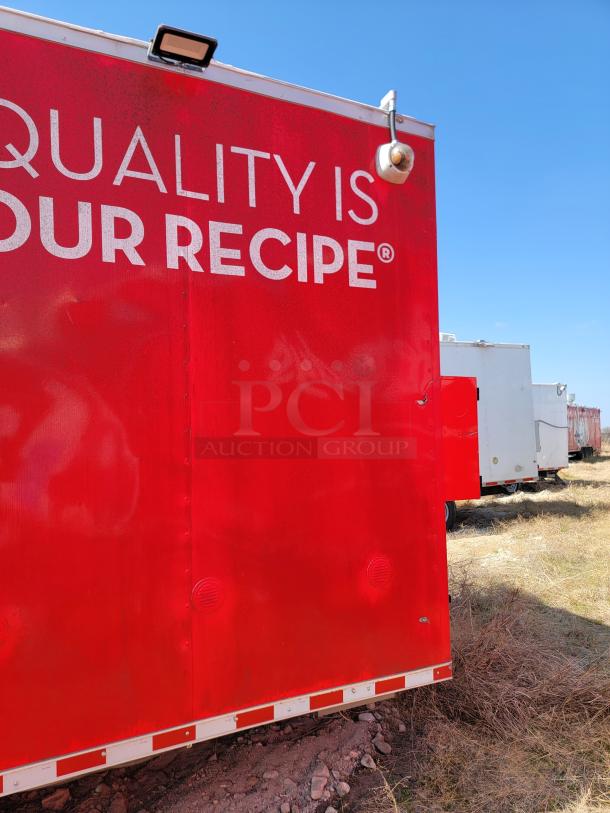 Red food truck with "QUALITY IS OUR RECIPE®" text. Exterior in good condition, visible outdoor setting.