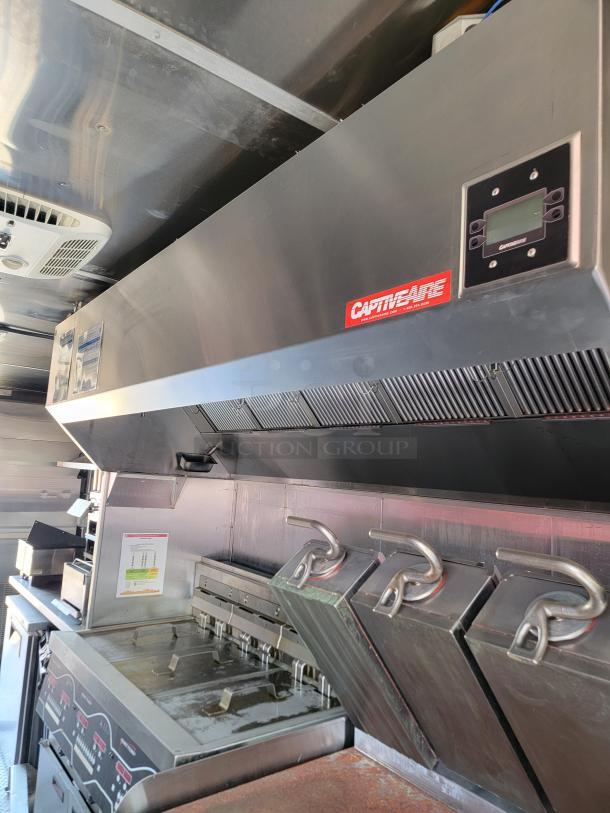 Commercial kitchen exhaust hood, CaptiveAire brand, stainless steel, integrated ventilation controls, used condition.
