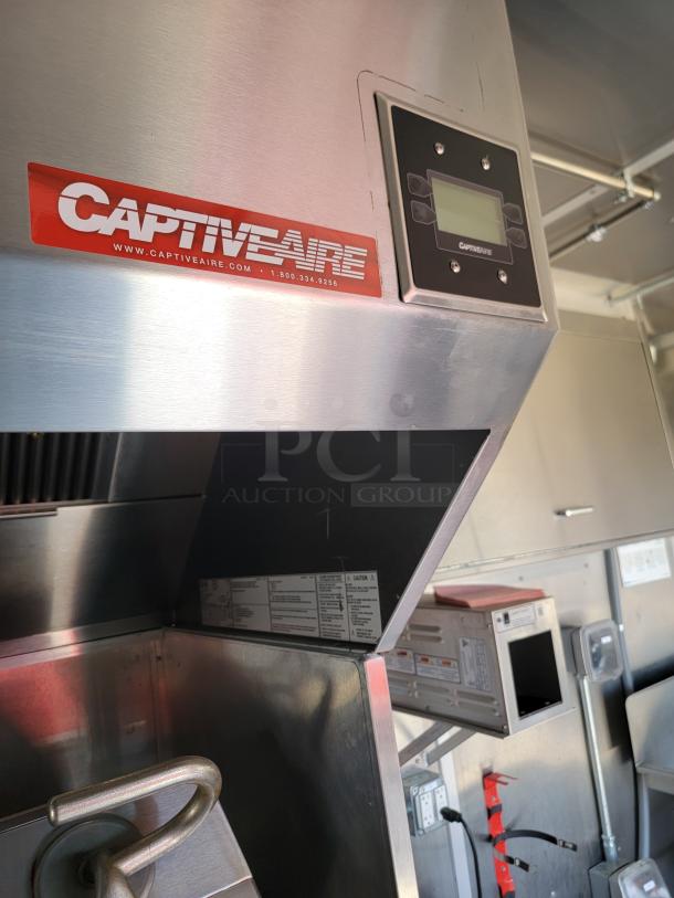 CaptiveAire commercial kitchen hood, stainless steel, with control panel and visible branding. Excellent condition.