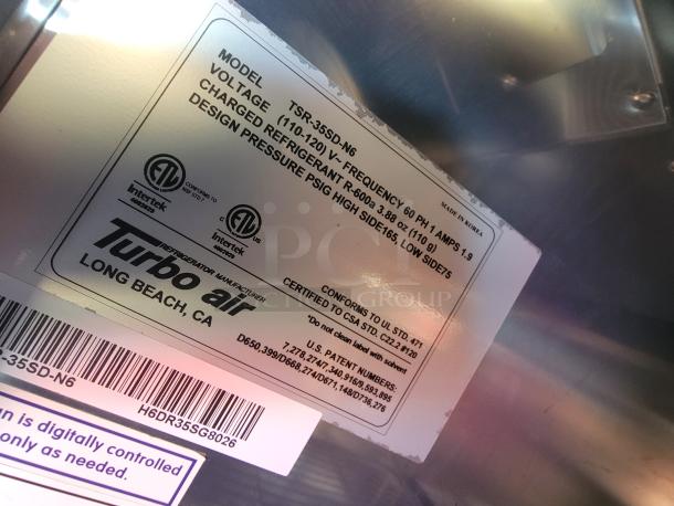 Turbo Air refrigerator label showing model TSR-35SD-N6, voltage, refrigerant charge, and design pressure details. Made in Korea.