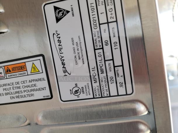 Henny Penny MPC-1L cooker label, model MPC1L.01. Serial GD2111071. 120V, 110W, UL certified. Made in USA. Warning: Hot surface.