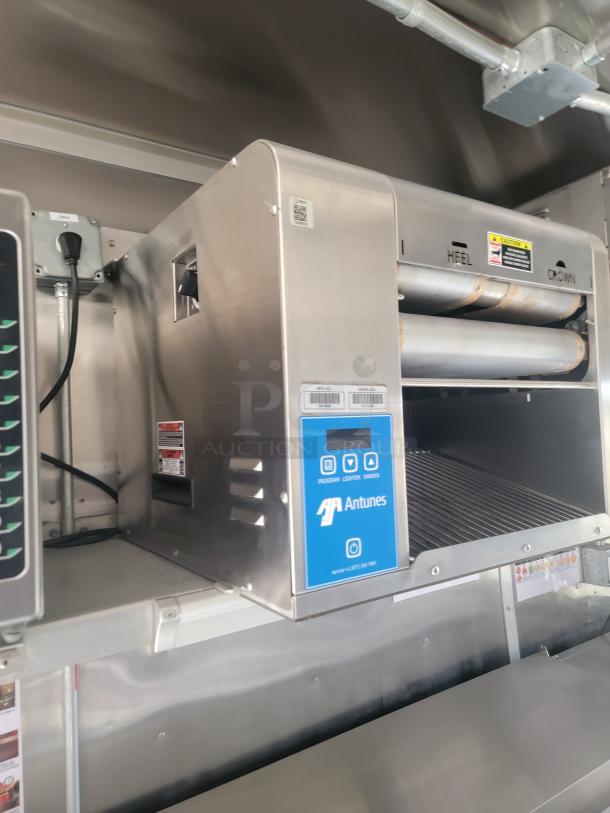 Antunes stainless steel toaster with digital controls. Features program, bypass, and drawer functions. Excellent condition.