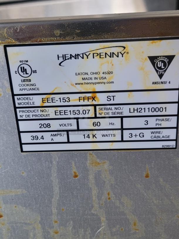 Henny Penny cooking appliance label, Model EEE-153, Serial LH2110001, 208V, 60Hz, 14KW, shows UL certification marks.