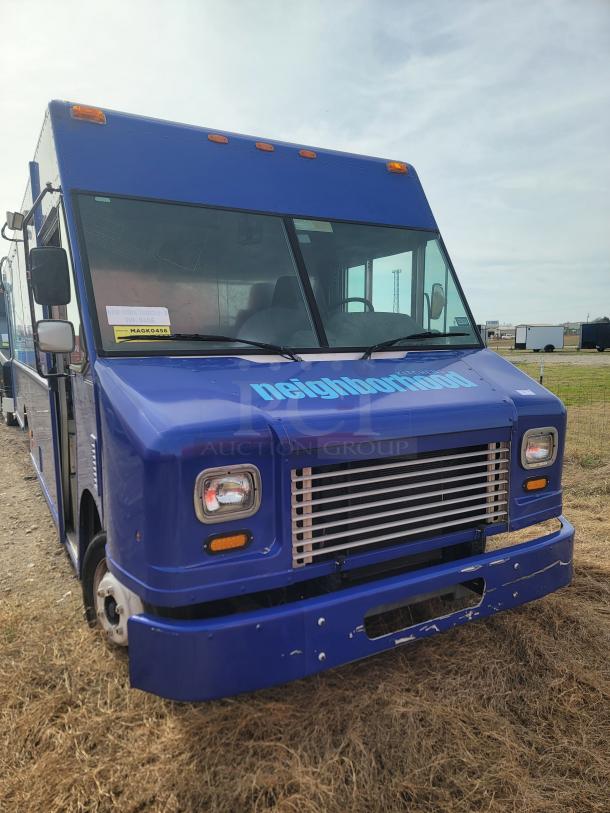 Blue food truck with "neighborhood" text, front view. Features include a large windshield and road-ready condition. Marked as New York Truck 456.