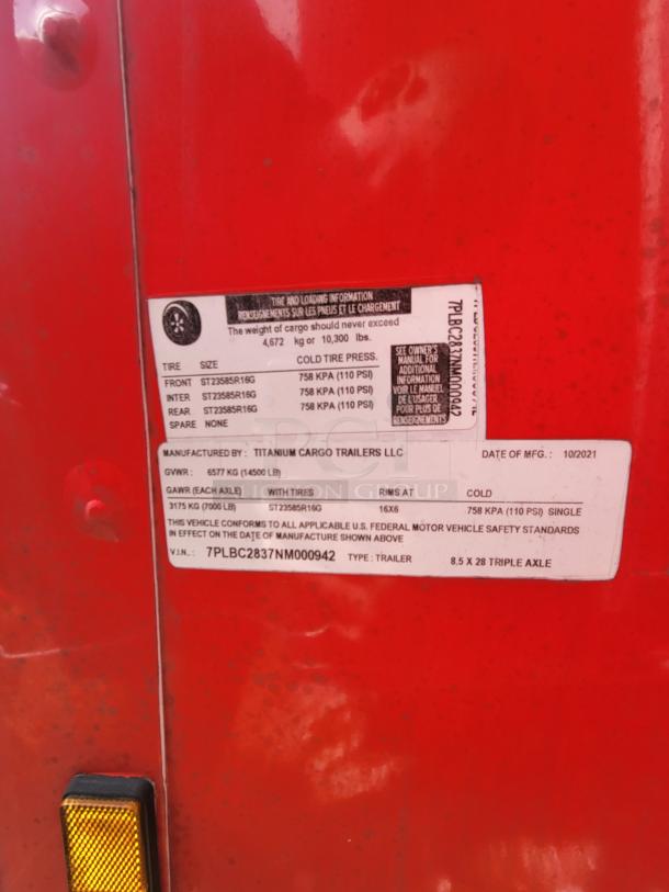 Red Titanum Cargo trailer label; max load 10,300 lbs, triple axle, date 10/2021, tire spec ST23585R16G. VIN: 7PLBC2837NM000942.