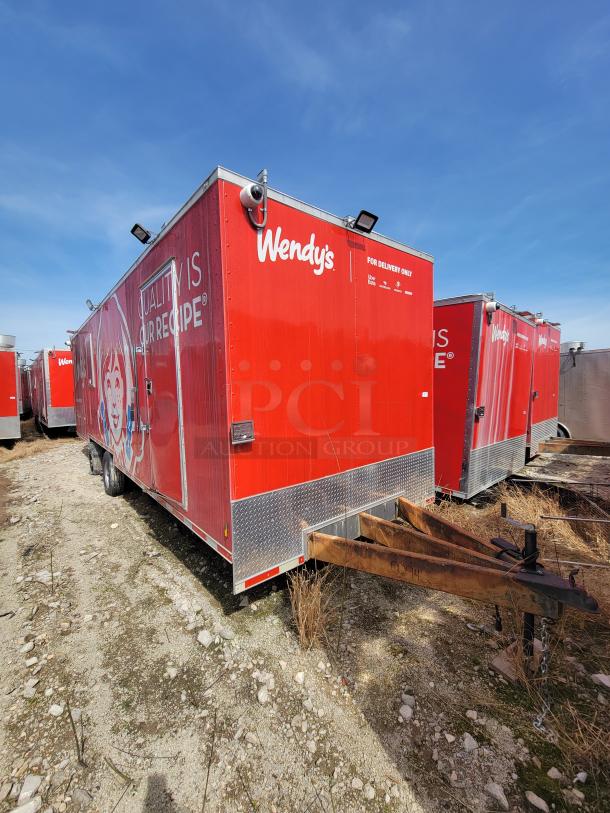 Red Wendy's trailer, used, with branding and "Quality is Our Recipe" slogan. Includes hitch; suitable for deliveries.