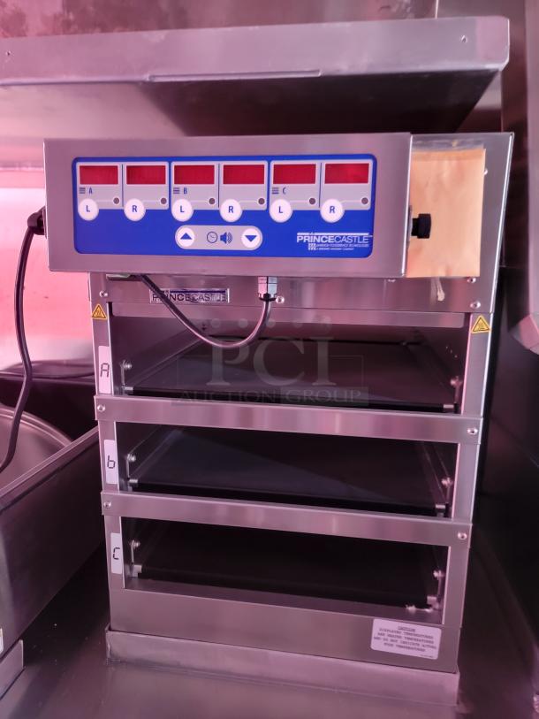 Prince Castle stainless steel food warmer, model ID-3. Three shelves labeled A, B, C; digital control panel. Excellent condition.
