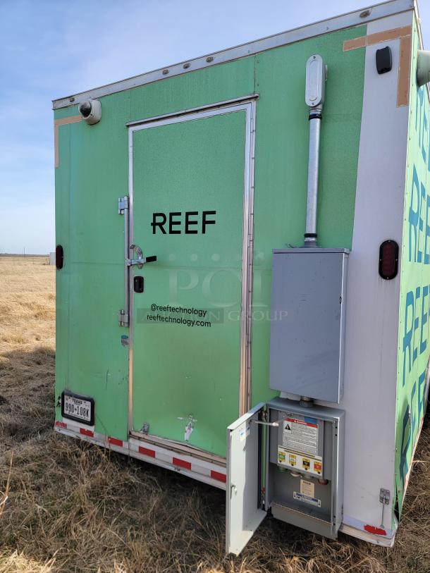 Green mobile unit with "REEF" branding. Features security camera, external control panel, and Texas license plate 990-108K.