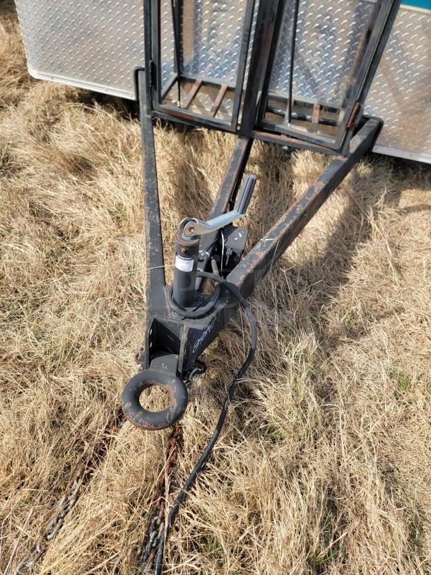 Towbar hitch with manual crank on steel frame, mounted on a utility trailer base. Rust visible, indicating used condition.