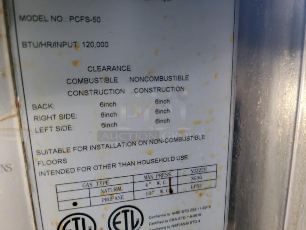 Model PCFS-50 label showing 120,000 BTU rating, clearance details, and installation suitability for non-combustible floors.