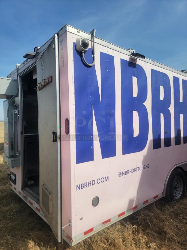 Mobile kitchen trailer with "NBRHD" branding, featuring a partially open door. Condition appears used. Website and social media details are visible.