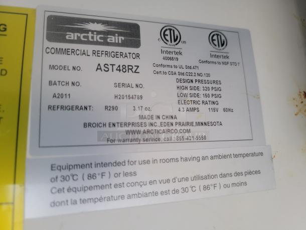Arctic Air AST48RZ commercial refrigerator label showing model, serial number H20154789, and refrigerant R290.