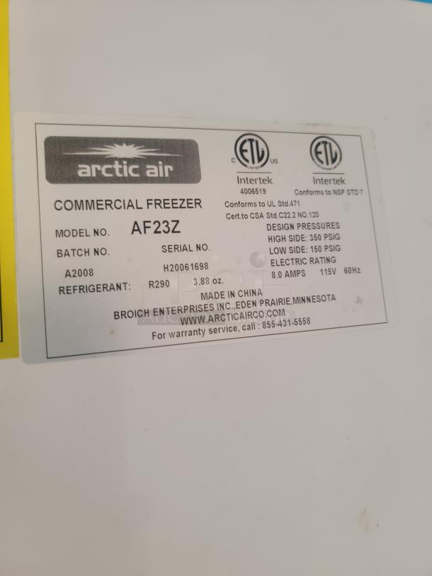 Label on Arctic Air commercial freezer, model AF23Z. Shows serial H20061698, 8.0 amps, 115V, R290 refrigerant. Made in China.