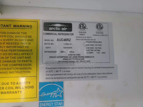 Arctic Air commercial refrigerator label showing model AUC48RZ, refrigerant R600a, and Energy Star certification.