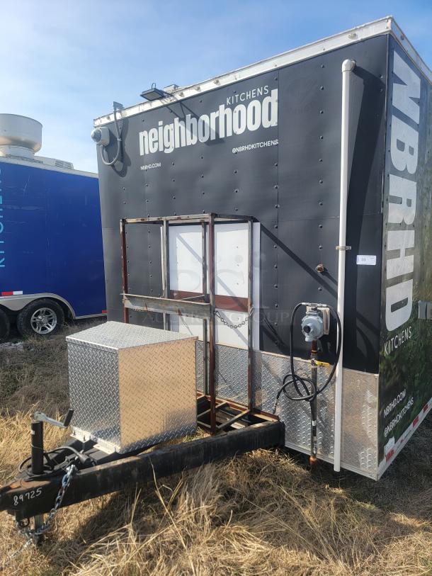 Mobile kitchen trailer, "Neighborhood Kitchens" branding, diamond plate tool box, good condition, utility hitch visible.