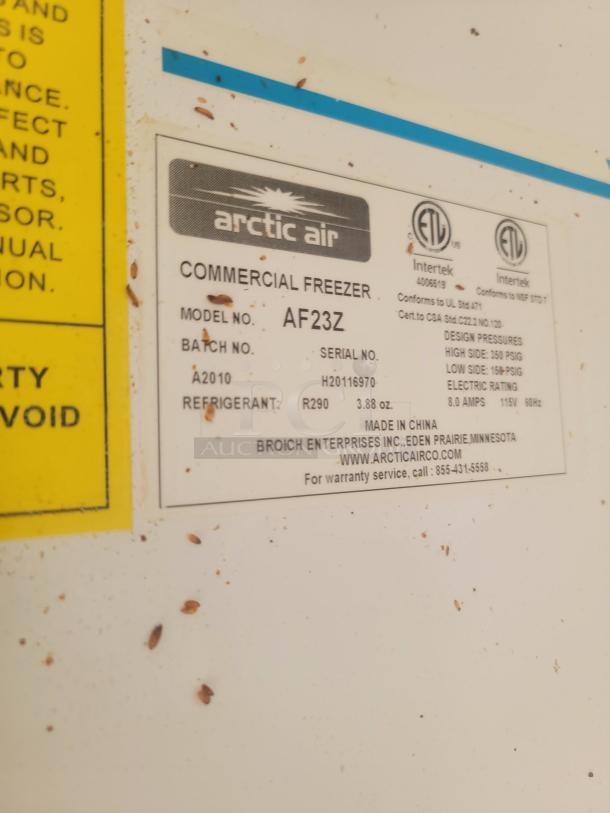Label on Arctic Air AF23Z commercial freezer; details model, serial, refrigerant type, electrical specs, made in China.