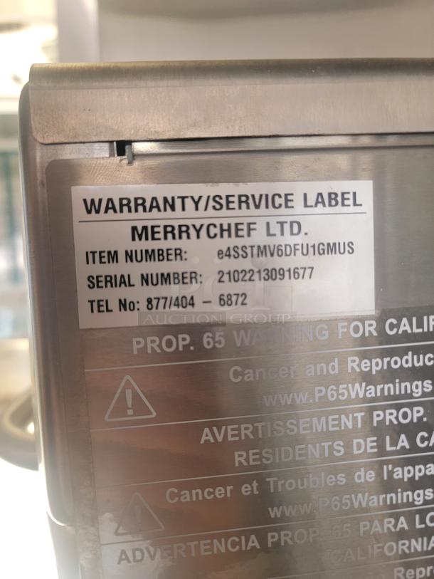 Merrychef oven label showing item number E4SSTMV6DFU1GMUS and serial number 2102213091677. Warranty and Prop 65 warning visible.