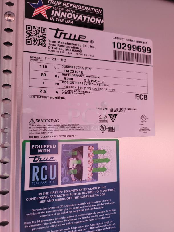 True Manufacturing T-23-HC Refrigerator label, serial 10299699. Features R290 refrigerant, EMC3121U compressor, UL and NSF certified.