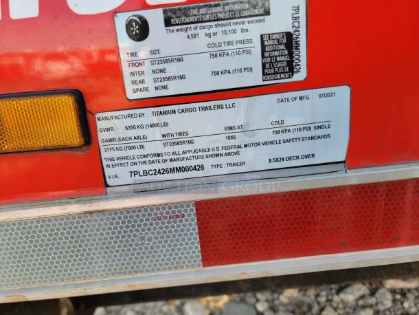 Titanium Cargo Trailers label on 8.5x24 deck over trailer. GVWR: 6350 kg, GAWR: 3175 kg, tire size: ST23585R16G. VIN: 7PLBC2426MM000426.