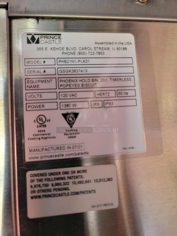 Prince Castle Phoenix Hold Bin label, model PHB21N1-PLK01, 120V, 1380W, manufactured 07/21, for Popeyes Biscuit.