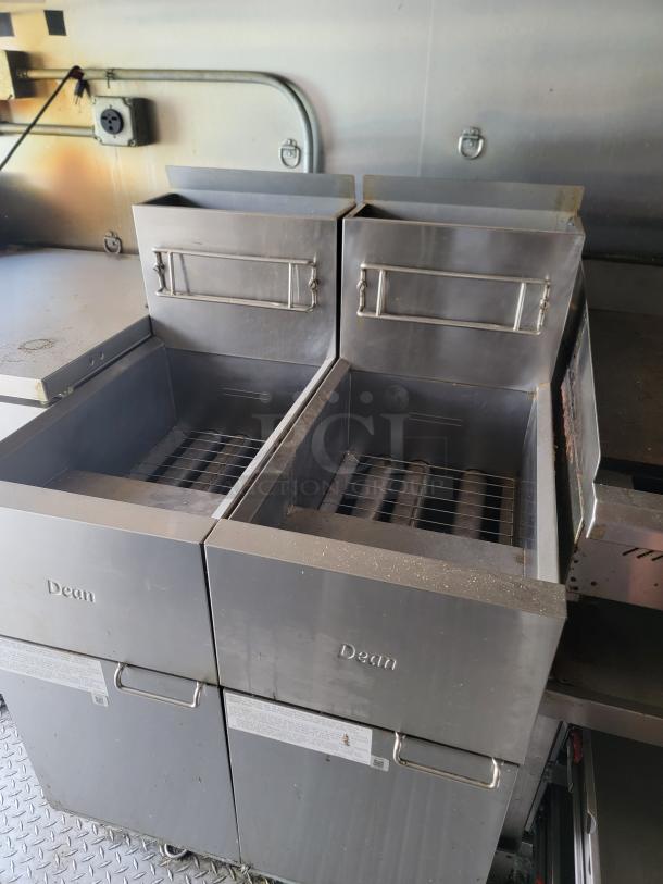 Dean commercial deep fryer set, stainless steel, dual-basket design, used condition, visible model tags, suitable for commercial kitchens.