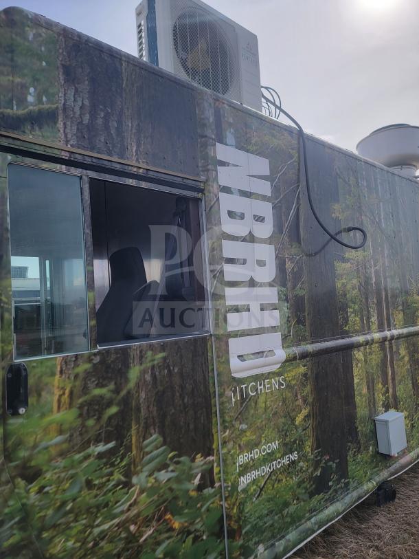2013 Freightliner MT45 mobile kitchen with forest-themed wrap, featuring Arctic Air refrigeration and Hoodz ventilation.