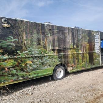 2013 Freightliner MT45 mobile kitchen truck with Utilimaster body, forest-themed wrap, featuring Arctic Air refrigeration.