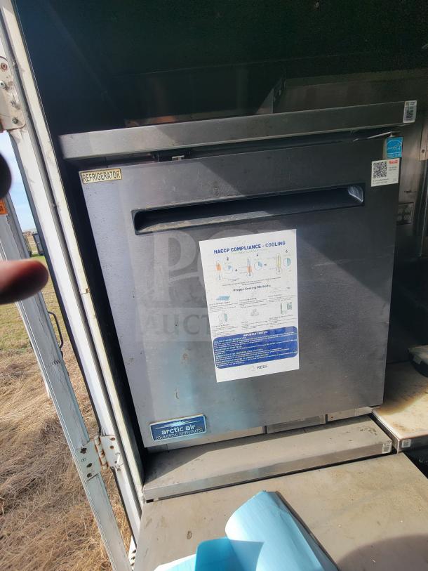 Arctic Air commercial refrigerator in a 2013 Freightliner MT45 mobile kitchen, showing HACCP compliance label and refrigeration tag.