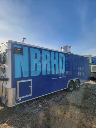 Blue mobile kitchen trailer with "NBRHD Kitchens" branding. Features include exterior ventilation and double axles. Good condition.