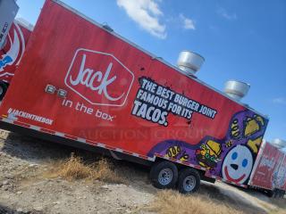 Red Jack in the Box food trailer with brand logo and taco-themed graphics, featuring dual wheels and rooftop vents.