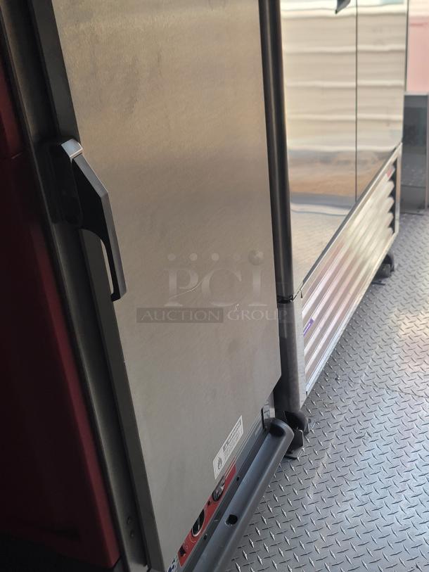 Stainless steel appliance in excellent condition, features a side handle and visible control panel markings.