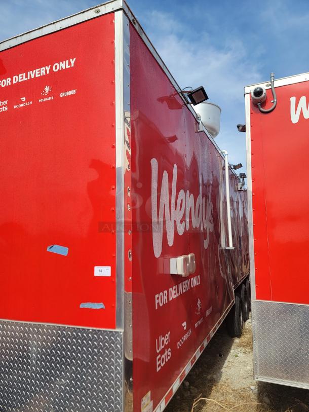 Red Wendy's food truck for delivery only, featuring logos for Uber Eats, DoorDash, Postmates, and Grubhub.