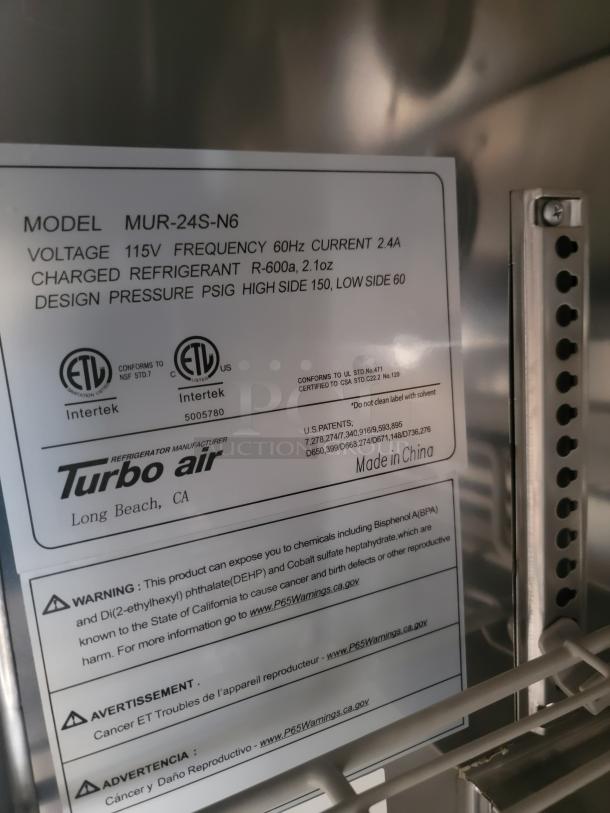 Turbo Air refrigerator, model MUR-24S-N6, 115V, R-600a refrigerant. Features tag shows voltage, frequency, and warnings.