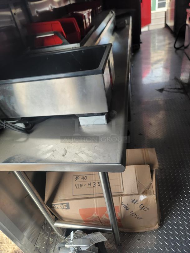 Stainless steel countertop with integrated sink and food storage containers in used condition. Box marked #40 VIN-4358 below.