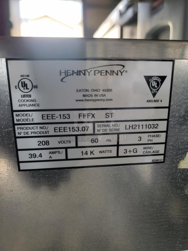 Henny Penny cooking appliance label, model EEE-153, serial LH2111032, 208 volts, 60 Hz, 14 KW, 3-phase, made in USA.