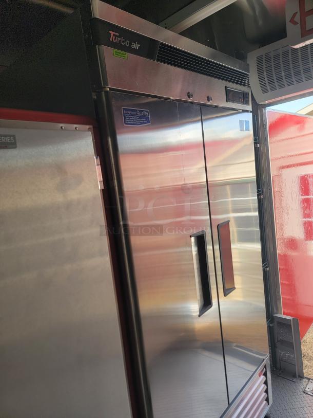 Turbo Air double-door commercial refrigerator, stainless steel, excellent condition, "Exceptional Quality" label, energy-efficient.