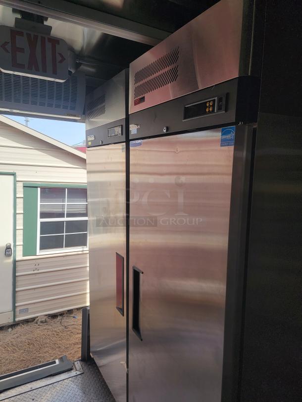 Stainless steel commercial refrigerator with digital controls and Energy Star label, good condition, vented top panel.