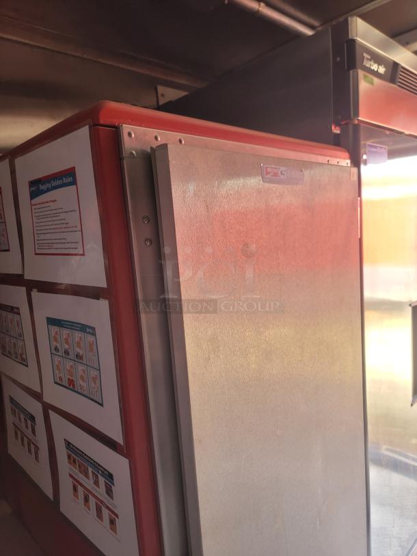 Commercial refrigerator with Metro logo, G3 5 Series label, and instructions on the side. Stainless steel door, slight wear.
