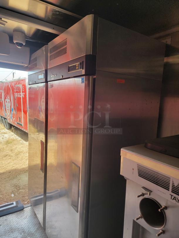 Stainless steel commercial refrigerator with digital display, clean exterior, suitable for food storage, in good condition.