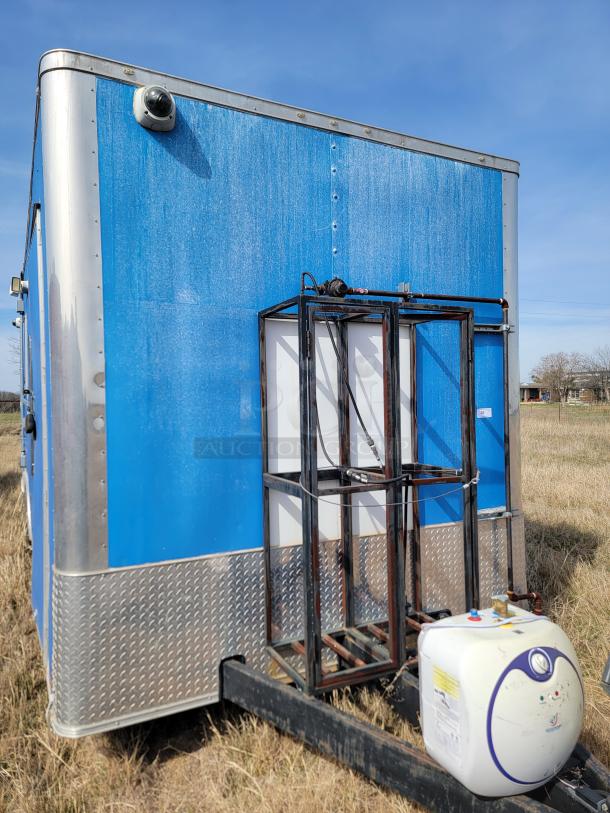 Blue utility trailer with diamond-plated trim, security camera, and mounted tank on hitch. Good condition, features durable frame.