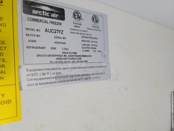 Arctic Air AUC27FZ commercial freezer label, model details, refrigerant type R290, and usage instructions shown.