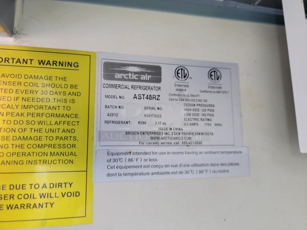 Arctic Air commercial refrigerator label, model AST48RZ, 115V, 4.3 amps, uses refrigerant R290. Warning label visible.