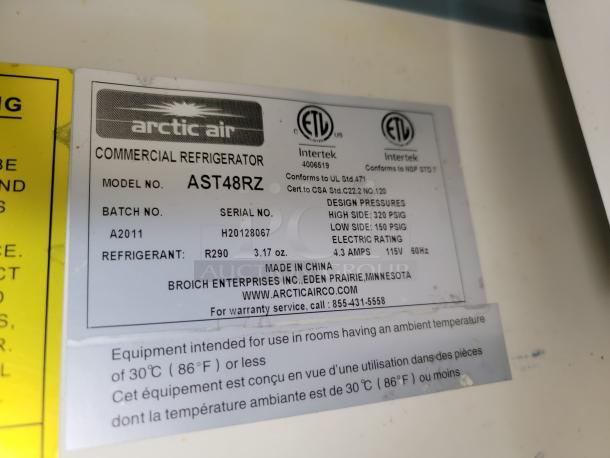 Arctic Air commercial refrigerator label, model AST48RZ. Batch A2011, serial H20128067, refrigerant R290, 115V, 60Hz.