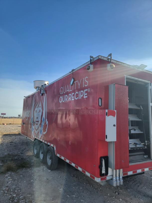 Red Wendy's food truck with logo, "Quality is Our Recipe" slogan on the side. Mounted equipment visible, exterior appears in good condition.