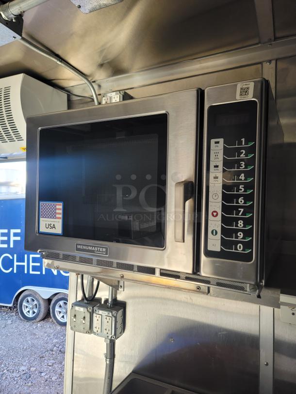 Menumaster commercial microwave in stainless steel with digital keypad. Features power levels and timer. Made in USA label.