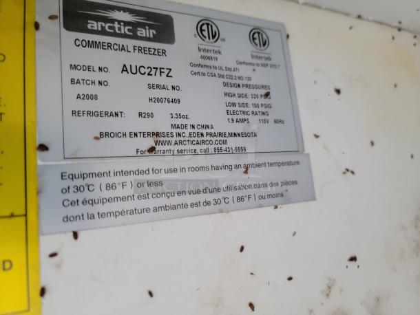 Arctic Air Commercial Freezer, Model AUC27FZ, uses R290 refrigerant. Label shows design pressures, electric rating, and use conditions.